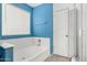 View of bathroom with tiled flooring, soaking tub, and a separate shower at 510 W Amoroso Dr, Gilbert, AZ 85233