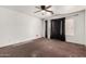 Spacious bedroom with ceiling fan fixture and window, providing ample natural light at 510 W Amoroso Dr, Gilbert, AZ 85233