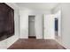 Bedroom featuring white walls, brown carpet, closet with sliding doors, and access to the hallway at 510 W Amoroso Dr, Gilbert, AZ 85233