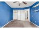 Bedroom featuring closet and doorway to en-suite bathroom at 510 W Amoroso Dr, Gilbert, AZ 85233