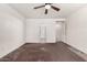 View of carpeted bedroom featuring a ceiling fan and two doorways at 510 W Amoroso Dr, Gilbert, AZ 85233