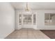 Bright dining area featuring tile flooring and a bay window overlooking the backyard at 510 W Amoroso Dr, Gilbert, AZ 85233