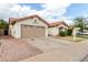 Charming home featuring a two-car garage, desert landscaping, and a cozy, inviting facade at 510 W Amoroso Dr, Gilbert, AZ 85233