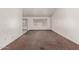 Spacious living room with a large window allowing for natural light and brown carpet at 510 W Amoroso Dr, Gilbert, AZ 85233