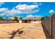 Large backyard with dirt, enclosed by a block wall, offering endless potential for landscaping or recreation at 524 S Pioneer --, Mesa, AZ 85204