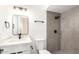 Modern bathroom featuring gray tile in shower, new vanity and dark hardware at 524 S Pioneer --, Mesa, AZ 85204