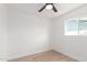 Neutral bedroom with wood-look floors and a bright window at 524 S Pioneer --, Mesa, AZ 85204