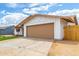 Neutral-colored garage with ample driveway space and side yard access at 524 S Pioneer --, Mesa, AZ 85204