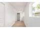 Hallway with a coat closet, shelving and window at 524 S Pioneer --, Mesa, AZ 85204