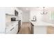 Bright kitchen featuring quartz countertops, modern appliances and white cabinetry at 524 S Pioneer --, Mesa, AZ 85204