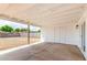 Covered patio with concrete flooring overlooking a spacious backyard, providing a comfortable outdoor space at 524 S Pioneer --, Mesa, AZ 85204