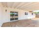 Covered patio featuring concrete flooring and a sliding glass door, perfect for outdoor relaxation and entertaining at 524 S Pioneer --, Mesa, AZ 85204