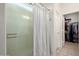 Bathroom shower features an updated enclosure and walk-in closet access at 5401 S Dove Holw, Buckeye, AZ 85326