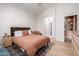 Comfortable bedroom features a ceiling fan, plush rug, and bathroom access at 5401 S Dove Holw, Buckeye, AZ 85326