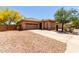 Well-maintained single-story home with a two-car garage and xeriscaping at 5401 S Dove Holw, Buckeye, AZ 85326