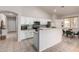 Modern kitchen with white cabinets, tile backsplash, and stainless steel appliances at 5401 S Dove Holw, Buckeye, AZ 85326