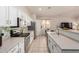 Stylish kitchen featuring stainless steel appliances, tile backsplash, and modern fixtures at 5401 S Dove Holw, Buckeye, AZ 85326