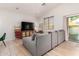 Inviting living room with vaulted ceilings, modern furniture, and a view of the pool at 5401 S Dove Holw, Buckeye, AZ 85326