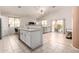Open concept kitchen and living space with stainless steel appliances at 5401 S Dove Holw, Buckeye, AZ 85326