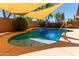 Outdoor pool featuring a baja shelf, tile accent wall, and clear cool water at 5401 S Dove Holw, Buckeye, AZ 85326