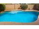 Backyard swimming pool featuring a tile accent wall and refreshing turquoise water at 5401 S Dove Holw, Buckeye, AZ 85326
