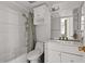 Bathroom featuring a double vanity, toilet, and shower-tub combo at 6236 N 16Th St # 1, Phoenix, AZ 85016