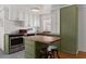 Updated kitchen featuring white cabinets, stainless steel appliances, and an island with seating at 6236 N 16Th St # 1, Phoenix, AZ 85016