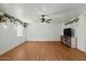 Spacious living room with updated flooring, a fan and natural lighting at 6236 N 16Th St # 1, Phoenix, AZ 85016