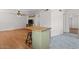 Open living room with hardwood flooring and a kitchen island with seating at 6236 N 16Th St # 1, Phoenix, AZ 85016