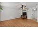 Spacious living room with updated flooring, a fan and natural lighting at 6236 N 16Th St # 1, Phoenix, AZ 85016