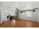 Open-concept living room with wood flooring, lots of light and adjacent kitchen at 6236 N 16Th St # 1, Phoenix, AZ 85016