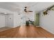 Open-concept living room with wood flooring, lots of light and adjacent kitchen at 6236 N 16Th St # 1, Phoenix, AZ 85016