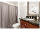 Classic bathroom with a wood vanity and granite countertops at 6426 W Lamar Rd, Glendale, AZ 85301