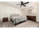 Cozy bedroom with carpeted floors, ceiling fan, and a view of the window at 6426 W Lamar Rd, Glendale, AZ 85301