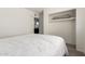Bright bedroom featuring carpet flooring, a ceiling fan, and a closet at 6426 W Lamar Rd, Glendale, AZ 85301
