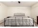Spacious bedroom featuring carpet flooring, a bed frame, and natural lighting at 6426 W Lamar Rd, Glendale, AZ 85301