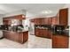 Modern kitchen featuring granite countertops, stainless steel appliances, and ample cabinet space at 6426 W Lamar Rd, Glendale, AZ 85301