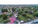Sprawling residential area featuring lush green trees, well-maintained homes, and a spacious grassy backyard at 645 S Esquire Way, Mesa, AZ 85202