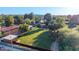 Expansive property featuring a large grassy yard and versatile outbuildings, ideal for various uses at 645 S Esquire Way, Mesa, AZ 85202