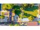 An expansive lot with lush greenery, a well-maintained lawn, and versatile outbuildings, perfect for various activities at 645 S Esquire Way, Mesa, AZ 85202