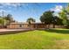 Beautiful backyard featuring a large lawn, mature landscaping, and a patio at 645 S Esquire Way, Mesa, AZ 85202