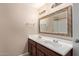 Bathroom featuring a double vanity with a large mirror and ample lighting at 645 S Esquire Way, Mesa, AZ 85202