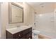 Neutral bathroom featuring a tub, tiled floor, and vanity with a large mirror at 645 S Esquire Way, Mesa, AZ 85202