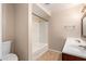 Bathroom featuring dual sinks, tile flooring, shower-tub, and neutral color scheme for a clean aesthetic at 645 S Esquire Way, Mesa, AZ 85202