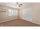 Comfortable bedroom with neutral walls, carpet floors, ceiling fan and window with shutters at 645 S Esquire Way, Mesa, AZ 85202
