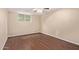Bedroom with hardwood flooring, neutral walls, ceiling fan, and a window offering natural light at 645 S Esquire Way, Mesa, AZ 85202