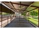 Overhead shot of covered stalls for horses or livestock with metal fencing and partial rubber floor covering at 645 S Esquire Way, Mesa, AZ 85202