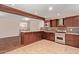 Gourmet kitchen with granite counters, stainless steel appliances, and custom backsplash at 645 S Esquire Way, Mesa, AZ 85202