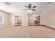 Open concept living area featuring neutral carpet and convenient access to the kitchen at 645 S Esquire Way, Mesa, AZ 85202