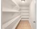 Walk-in pantry with adjustable shelves and ample storage space at 645 S Esquire Way, Mesa, AZ 85202